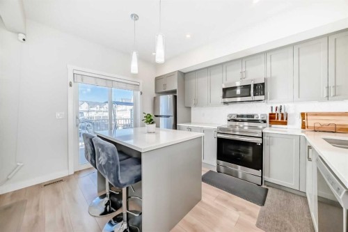240 Copperleaf Way Se, Calgary, AB - Indoor Photo Showing Kitchen