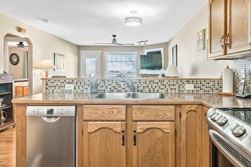 142 Freeman Way Nw, High River, AB - Indoor Photo Showing Kitchen With Double Sink
