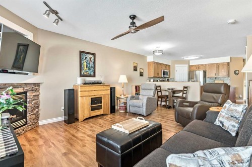142 Freeman Way Nw, High River, AB - Indoor Photo Showing Living Room With Fireplace