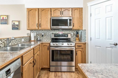 142 Freeman Way Nw, High River, AB - Indoor Photo Showing Kitchen With Double Sink