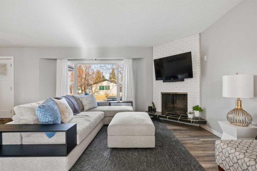 304 Wascana Crescent Se, Calgary, AB - Indoor Photo Showing Living Room With Fireplace