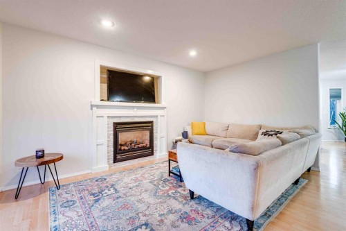 307 Regal Crescent, Trochu, AB - Indoor Photo Showing Living Room With Fireplace