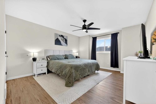 250 Cimarron Boulevard, Okotoks, AB - Indoor Photo Showing Bedroom
