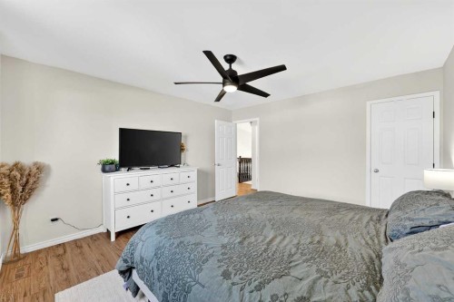 250 Cimarron Boulevard, Okotoks, AB - Indoor Photo Showing Bedroom