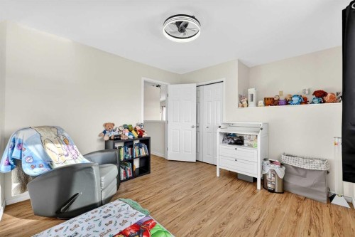 250 Cimarron Boulevard, Okotoks, AB - Indoor Photo Showing Bedroom