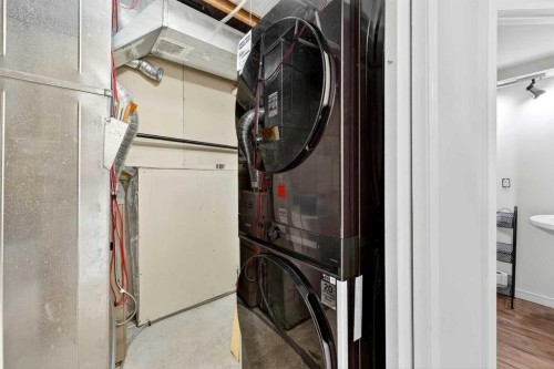 250 Cimarron Boulevard, Okotoks, AB - Indoor Photo Showing Laundry Room