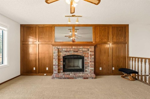224 Eldorado Place Ne, Calgary, AB - Indoor Photo Showing Living Room With Fireplace
