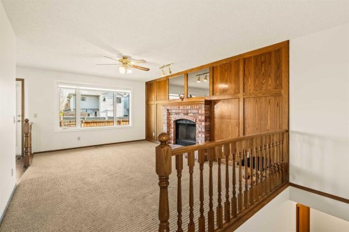 224 Eldorado Place Ne, Calgary, AB - Indoor With Fireplace