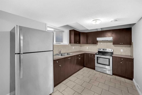 422 Taralake Way Ne, Calgary, AB - Indoor Photo Showing Kitchen With Double Sink