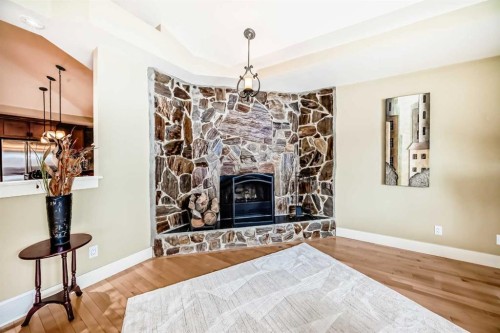 36 Dalrymple Green Nw, Calgary, AB - Indoor Photo Showing Living Room With Fireplace