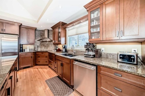 36 Dalrymple Green Nw, Calgary, AB - Indoor Photo Showing Kitchen With Double Sink