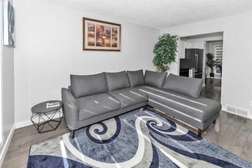 151-6915 Ranchview Drive Nw, Calgary, AB - Indoor Photo Showing Living Room