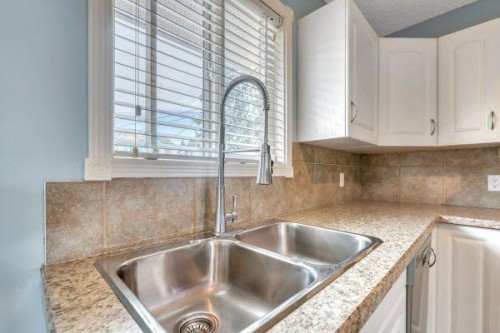 8319 Bowness Road, Calgary, AB - Indoor Photo Showing Kitchen With Double Sink