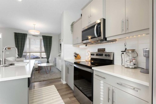 277 Ellen Way, Crossfield, AB - Indoor Photo Showing Kitchen With Double Sink With Upgraded Kitchen