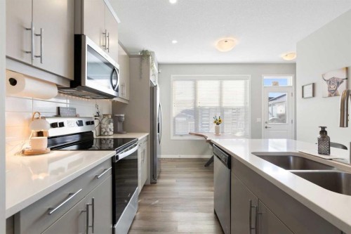 277 Ellen Way, Crossfield, AB - Indoor Photo Showing Kitchen With Double Sink With Upgraded Kitchen