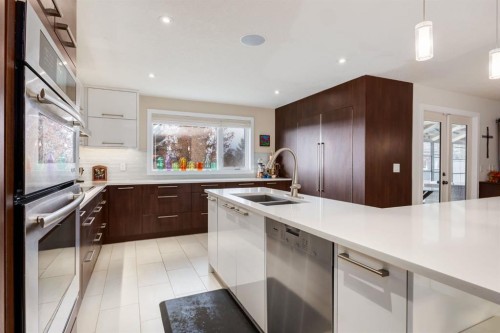 16 Silvercreek Place Nw, Calgary, AB - Indoor Photo Showing Kitchen With Double Sink With Upgraded Kitchen