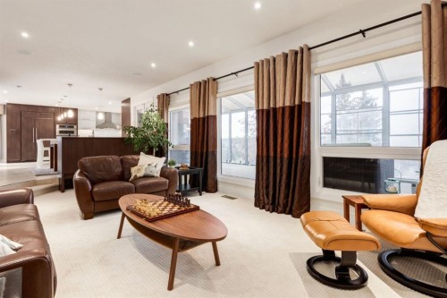 16 Silvercreek Place Nw, Calgary, AB - Indoor Photo Showing Living Room With Fireplace