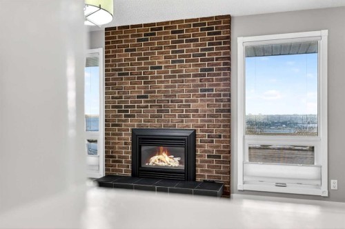 740 Lysander Drive Se, Calgary, AB - Indoor Photo Showing Living Room With Fireplace