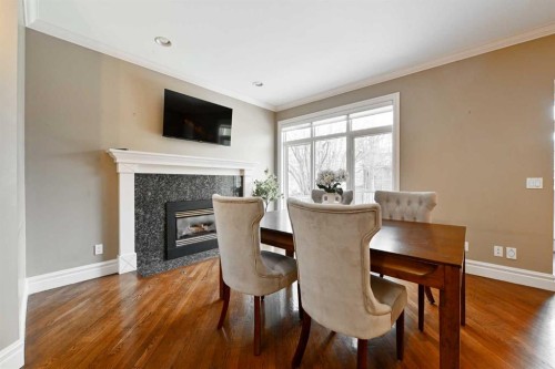 3821 1A Street Sw, Calgary, AB - Indoor Photo Showing Dining Room With Fireplace