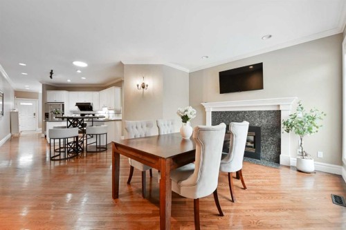 3821 1A Street Sw, Calgary, AB - Indoor Photo Showing Dining Room With Fireplace