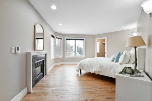 3821 1A Street Sw, Calgary, AB - Indoor Photo Showing Bedroom With Fireplace