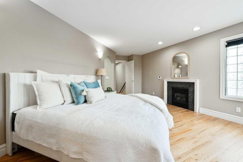 3821 1A Street Sw, Calgary, AB - Indoor Photo Showing Bedroom With Fireplace