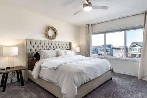 23 Cranbrook Green Se, Calgary, AB - Indoor Photo Showing Bedroom