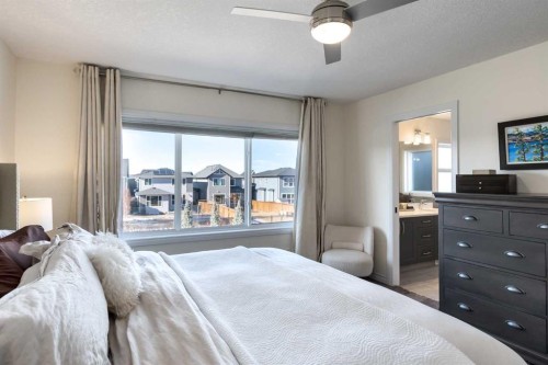 23 Cranbrook Green Se, Calgary, AB - Indoor Photo Showing Bedroom