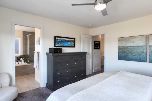 23 Cranbrook Green Se, Calgary, AB - Indoor Photo Showing Bedroom