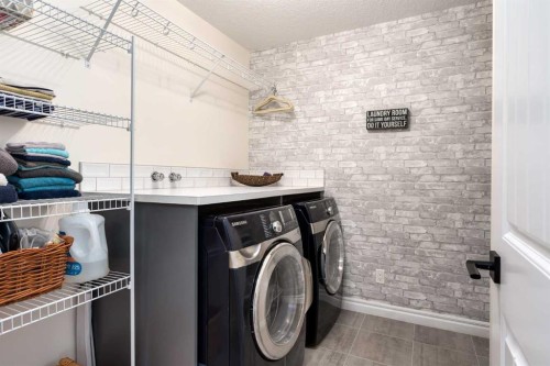 23 Cranbrook Green Se, Calgary, AB - Indoor Photo Showing Laundry Room