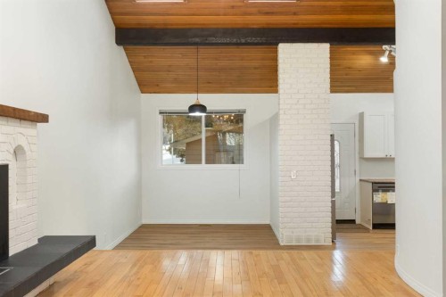 639 Canterbury Drive Sw, Calgary, AB - Indoor Photo Showing Other Room With Fireplace
