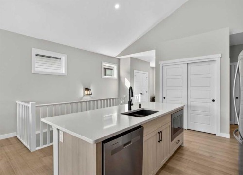 184 Precedence Hill, Cochrane, AB - Indoor Photo Showing Kitchen With Double Sink