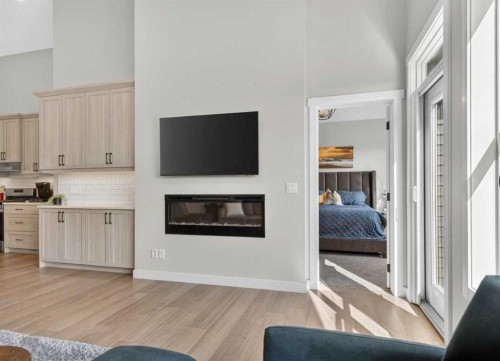 184 Precedence Hill, Cochrane, AB - Indoor Photo Showing Living Room With Fireplace