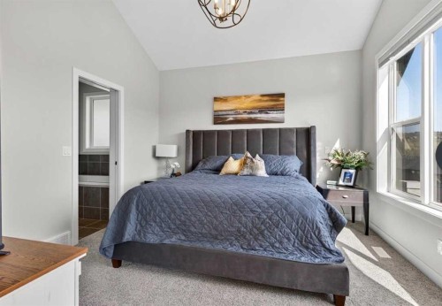 184 Precedence Hill, Cochrane, AB - Indoor Photo Showing Bedroom