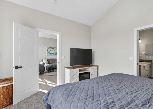 184 Precedence Hill, Cochrane, AB - Indoor Photo Showing Bedroom