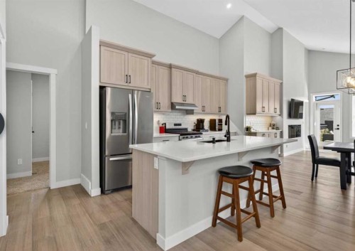 184 Precedence Hill, Cochrane, AB - Indoor Photo Showing Kitchen With Upgraded Kitchen
