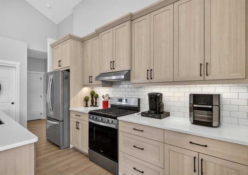 184 Precedence Hill, Cochrane, AB - Indoor Photo Showing Kitchen With Upgraded Kitchen