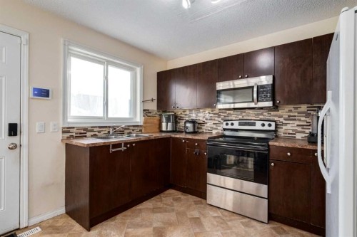 150 Martinbrook Road Ne, Calgary, AB - Indoor Photo Showing Kitchen With Double Sink