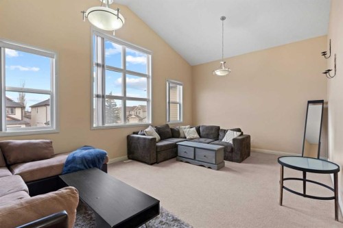 137 Copperleaf Bay Se, Calgary, AB - Indoor Photo Showing Living Room
