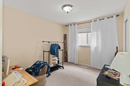 137 Copperleaf Bay Se, Calgary, AB - Indoor Photo Showing Gym Room
