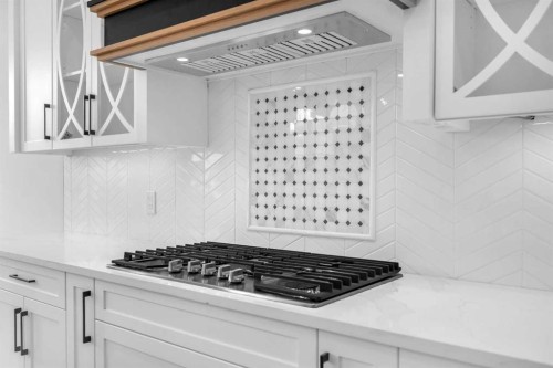 203 Kinniburgh Place, Chestermere, AB - Indoor Photo Showing Kitchen With Upgraded Kitchen