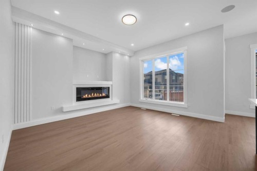 203 Kinniburgh Place, Chestermere, AB - Indoor Photo Showing Living Room With Fireplace
