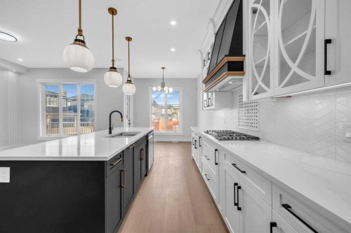 203 Kinniburgh Place, Chestermere, AB - Indoor Photo Showing Kitchen With Upgraded Kitchen