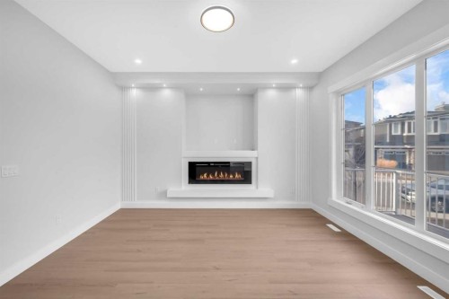 203 Kinniburgh Place, Chestermere, AB - Indoor With Fireplace