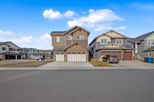 203 Kinniburgh Place, Chestermere, AB - Outdoor With Facade