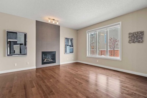2306 Bayside Circle Sw, Airdrie, AB - Indoor Photo Showing Living Room With Fireplace