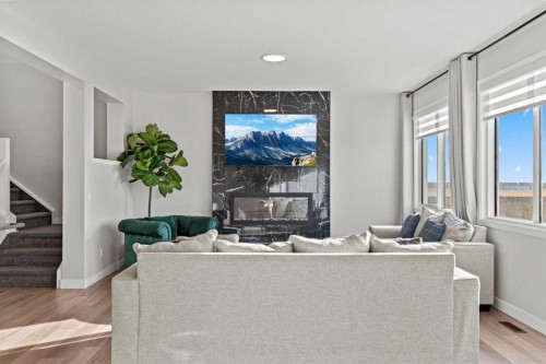 461 Corner Meadows Way Ne, Calgary, AB - Indoor Photo Showing Living Room With Fireplace