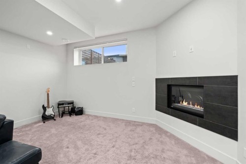 4906 21 Street Sw, Calgary, AB - Indoor With Fireplace
