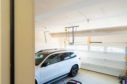 228 Windrow Link Sw, Airdrie, AB - Indoor Photo Showing Garage