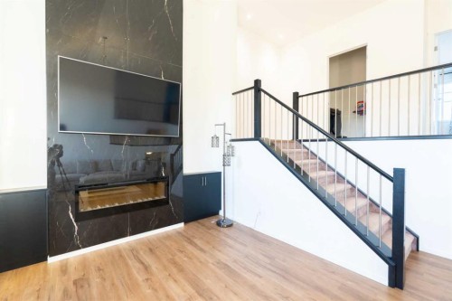228 Windrow Link Sw, Airdrie, AB - Indoor With Fireplace